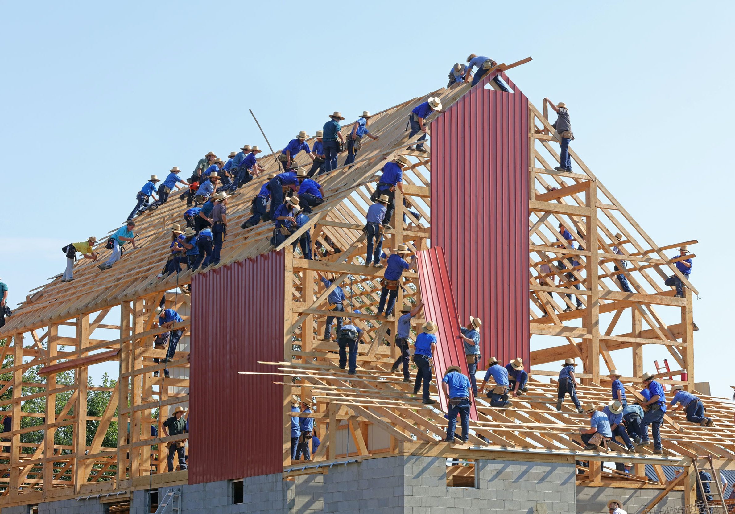 People building a house